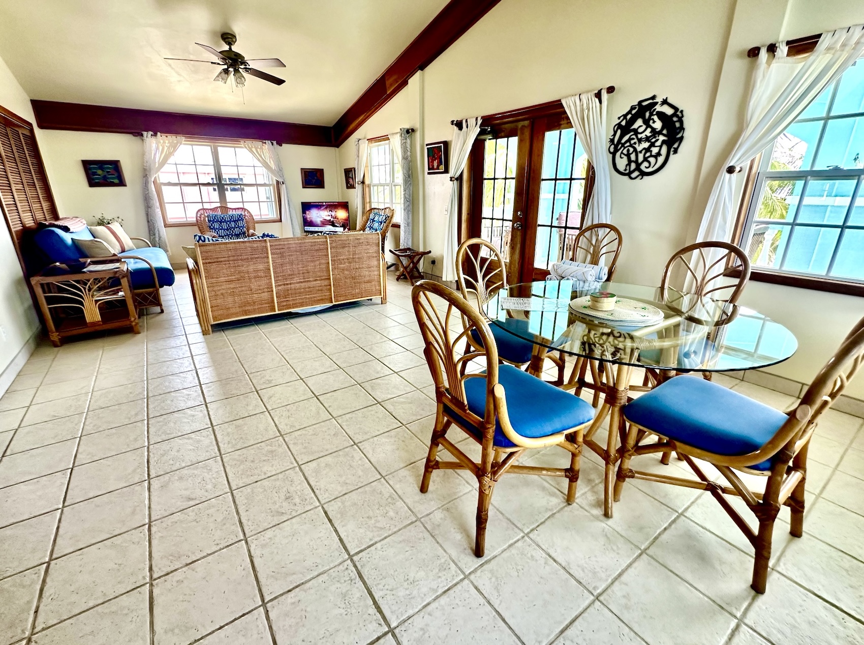 Dining/living area, doors to balcony on right